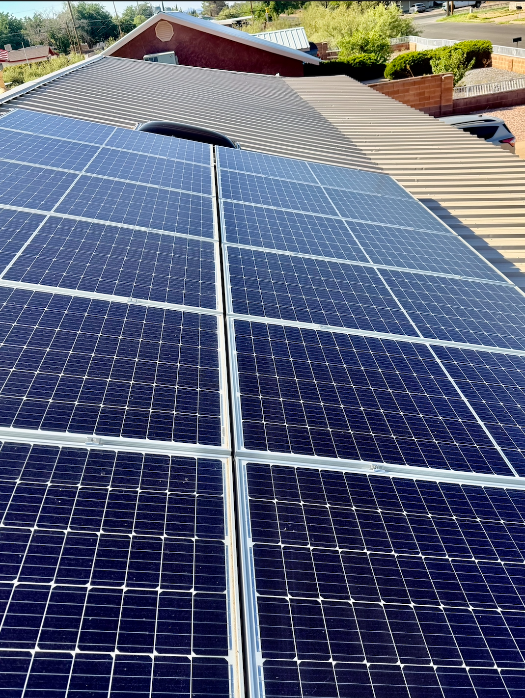 Dirty solar panels covered in desert dust before cleaning